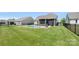A private backyard with a beautiful pool, patio, screened in porch and well-manicured lawn at 1963 Felts Pkwy, Fort Mill, SC 29715
