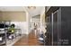 Open foyer with hardwood floors, decorative accents and a view into the living spaces at 1963 Felts Pkwy, Fort Mill, SC 29715