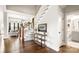 Welcoming foyer with hardwood staircase and view of the spacious living room beyond at 1963 Felts Pkwy, Fort Mill, SC 29715