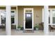 Charming front door with sidelight windows, decorative plants and a 'hello' door mat at 1963 Felts Pkwy, Fort Mill, SC 29715