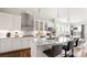Bright and modern kitchen with white cabinetry, granite countertops, and stainless steel appliances at 1963 Felts Pkwy, Fort Mill, SC 29715