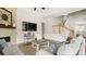 Spacious living room with hardwood floors, modern decor, and staircase access at 1963 Felts Pkwy, Fort Mill, SC 29715