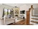 Cozy living room with a fireplace, high ceilings and lots of natural light from large windows at 1963 Felts Pkwy, Fort Mill, SC 29715