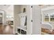 Inviting mudroom with coat hooks and storage, leading to a bedroom, and living room in this stylish home at 1963 Felts Pkwy, Fort Mill, SC 29715