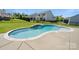 Backyard pool with stone trim and waterfall feature at 1963 Felts Pkwy, Fort Mill, SC 29715
