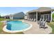 Sparkling backyard pool, surrounded by patio and lounge chairs at 1963 Felts Pkwy, Fort Mill, SC 29715