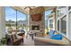 Relaxing screened porch with brick fireplace and comfortable seating at 1963 Felts Pkwy, Fort Mill, SC 29715