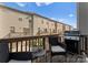 Outdoor balcony with seating, a barbecue grill and a view of neighboring townhomes at 2037 Birchside Dr, Charlotte, NC 28205