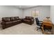 Basement featuring large couches, carpet, desk and natural light at 2037 Birchside Dr, Charlotte, NC 28205
