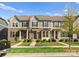 Townhome exteriors feature a mix of stone accents, gray siding, and well-maintained landscaping for curb appeal at 2037 Birchside Dr, Charlotte, NC 28205
