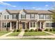 Charming townhomes with stone and siding, complemented by well-manicured lawns, and inviting front entrances at 2037 Birchside Dr, Charlotte, NC 28205