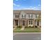 Charming townhomes showcase stone accents, manicured lawns, and inviting entryways, creating an appealing curb presence at 2037 Birchside Dr, Charlotte, NC 28205