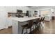Modern kitchen with a large island, stainless steel appliances, and comfortable seating for casual dining at 2037 Birchside Dr, Charlotte, NC 28205