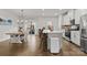 Bright, modern kitchen with stainless steel appliances, quartz countertops, and a spacious island with seating at 2037 Birchside Dr, Charlotte, NC 28205