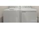 This is an image of white, front-loading washer and dryer at 2037 Birchside Dr, Charlotte, NC 28205