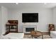 Cozy living room with a fireplace, television, and comfortable sectional sofa, creating a relaxing atmosphere at 2037 Birchside Dr, Charlotte, NC 28205