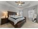 Spacious main bedroom with large bed, ceiling fan and natural lighting at 2037 Birchside Dr, Charlotte, NC 28205
