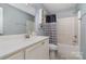 Bathroom featuring a vanity with a sink, toilet, and a shower/tub combination with a patterned shower curtain at 204 Millwheel Ln, Mount Gilead, NC 27306