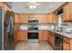 Modern kitchen with stainless steel appliances, granite countertops, and tile backsplash at 204 Millwheel Ln, Mount Gilead, NC 27306