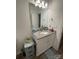 Cozy bathroom featuring a granite countertop vanity with a large mirror and neutral wall color at 205 E Maine Ave, Bessemer City, NC 28016