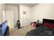 Bedroom featuring neutral walls, carpet floors, and a closet with a basketball hoop indoors at 205 E Maine Ave, Bessemer City, NC 28016