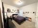 Bright bedroom with carpet, comfortable bed and posters on the walls at 205 E Maine Ave, Bessemer City, NC 28016