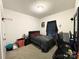 A simple bedroom with a bed and small basketball hoop at 205 E Maine Ave, Bessemer City, NC 28016