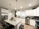 Well-lit kitchen featuring granite countertops, stainless steel appliances, and an island with pendant lighting at 205 E Maine Ave, Bessemer City, NC 28016