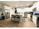 Bright kitchen with stainless steel appliances, granite countertops, and a kitchen island with barstool seating at 205 E Maine Ave, Bessemer City, NC 28016