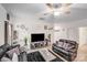 Comfortable living room featuring contemporary decor, a dark rug, and a large screen TV at 205 E Maine Ave, Bessemer City, NC 28016