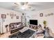 Spacious living room with cozy seating, a dark rug, and ample natural light at 205 E Maine Ave, Bessemer City, NC 28016