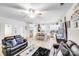Open-concept living room with a kitchen featuring a center island with barstool seating at 205 E Maine Ave, Bessemer City, NC 28016