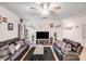 Cozy living room features hardwood floors and a large TV for entertainment at 205 E Maine Ave, Bessemer City, NC 28016