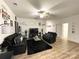 Spacious living room features modern decor, ceiling fan and wood flooring at 205 E Maine Ave, Bessemer City, NC 28016