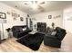 This living room has comfortable seating, hardwood floors, and a dark rug at 205 E Maine Ave, Bessemer City, NC 28016