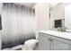 Clean bathroom featuring a modern vanity, toilet, and a stylish shower curtain at 2111 Savoy Pl, Fort Mill, SC 29707