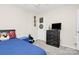 This room includes a blue bed, a dresser with a TV, and comic book artwork on the wall at 2111 Savoy Pl, Fort Mill, SC 29707