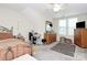 Bright bedroom with a large window, comfortable bed, a ceiling fan, and adjacent storage at 2111 Savoy Pl, Fort Mill, SC 29707