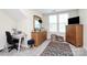 Bright bedroom with large windows, lots of storage, and a comfortable area for working or relaxing at 2111 Savoy Pl, Fort Mill, SC 29707