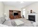 Spacious living room with entertainment center, fireplace, and plush seating perfect for relaxation at 2111 Savoy Pl, Fort Mill, SC 29707