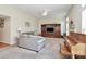 Cozy living room with a large entertainment center, comfortable seating, and a ceiling fan at 2111 Savoy Pl, Fort Mill, SC 29707