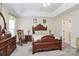 Charming main bedroom featuring a tray ceiling, traditional furniture, and plenty of natural light at 2111 Savoy Pl, Fort Mill, SC 29707