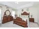 Elegant main bedroom with a tray ceiling, matching furniture, and a serene ambiance at 2111 Savoy Pl, Fort Mill, SC 29707