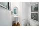 Half bath featuring a pedestal sink, decorative art, and modern fixtures at 215 Giant Oak Ave, Statesville, NC 28677