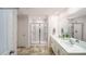Modern bathroom featuring double sinks, tile flooring, and glass shower at 215 Giant Oak Ave, Statesville, NC 28677