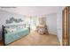 Bright bedroom with a charming daybed, natural light, and stylish decor at 215 Giant Oak Ave, Statesville, NC 28677