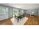 Open-concept dining area connected to the living room, and kitchen, perfect for entertaining at 215 Giant Oak Ave, Statesville, NC 28677