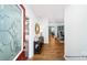 Bright entryway with wood floors, a console table and stylish decor that leads into the dining area at 215 Giant Oak Ave, Statesville, NC 28677