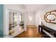 Inviting entryway with hardwood floors, french doors to an office, and a decorative mirror at 215 Giant Oak Ave, Statesville, NC 28677
