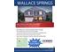 Two-story home with a stone and siding exterior, two-car garage, and landscaped surroundings at 215 Giant Oak Ave, Statesville, NC 28677